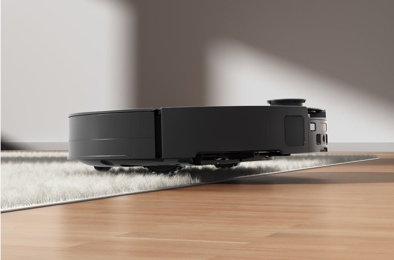 Roborock Saros 10 on a light rug beside a wooden floor